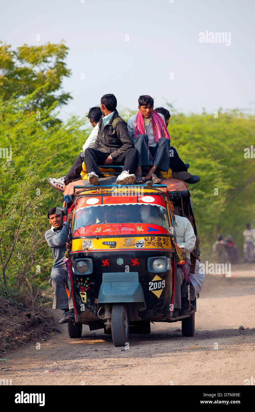 Stock photo of Typical rural transport, overloaded van with people,  Maharashtra, India. Available for sale on