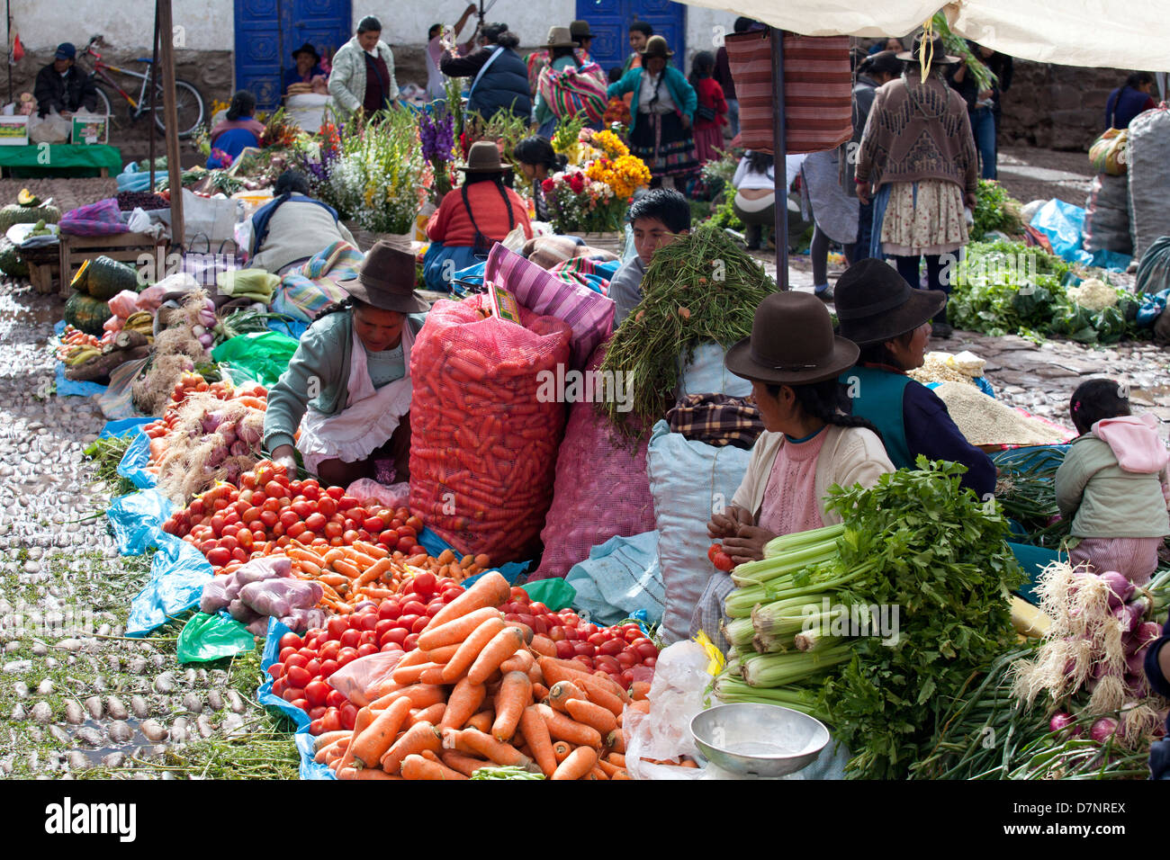 Quechua women selling vegetables at Pisac market Stock Photo
