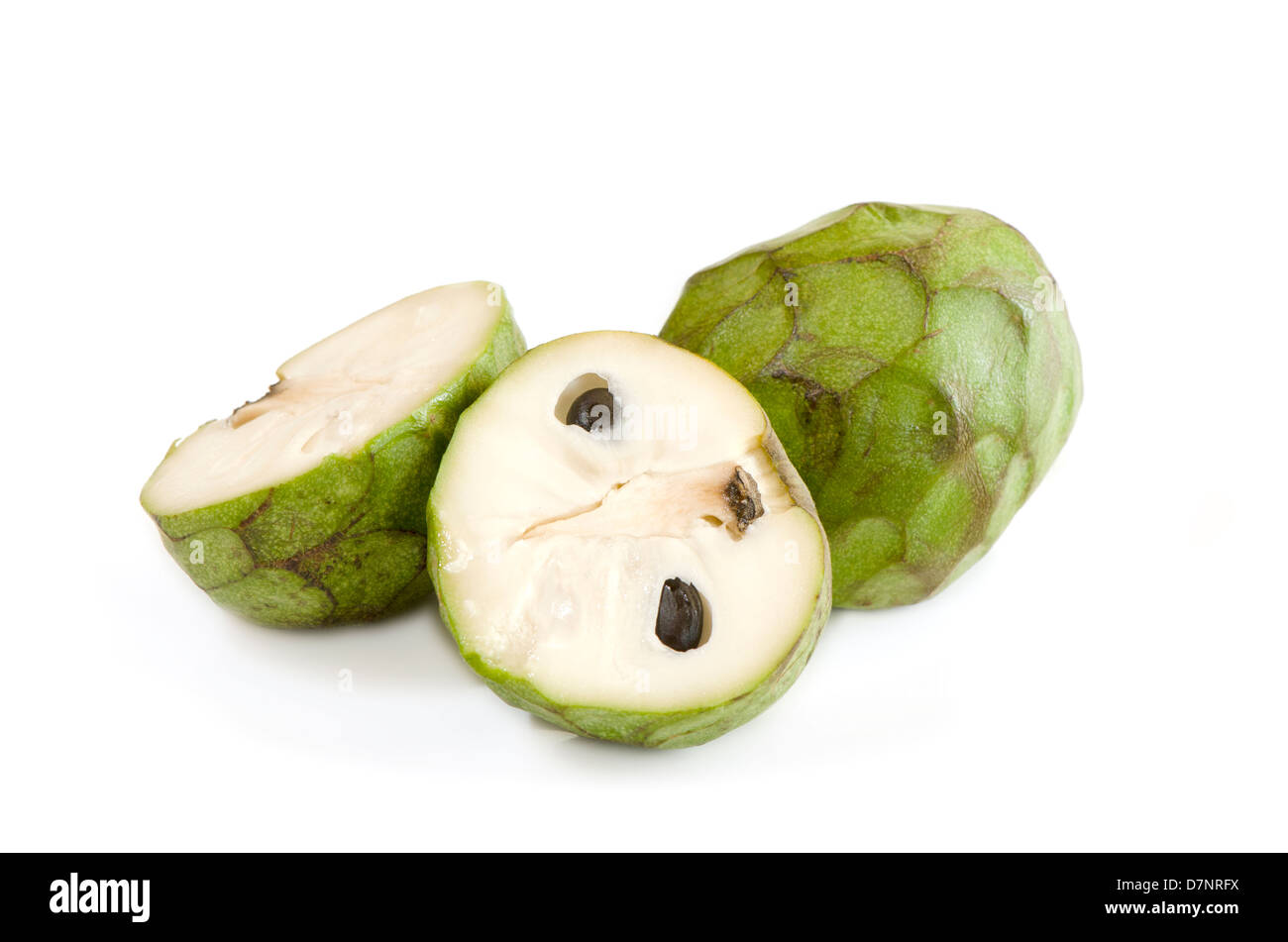 Cut open Cherimoyas on a white background. Andalusia, Spain. Stock Photo