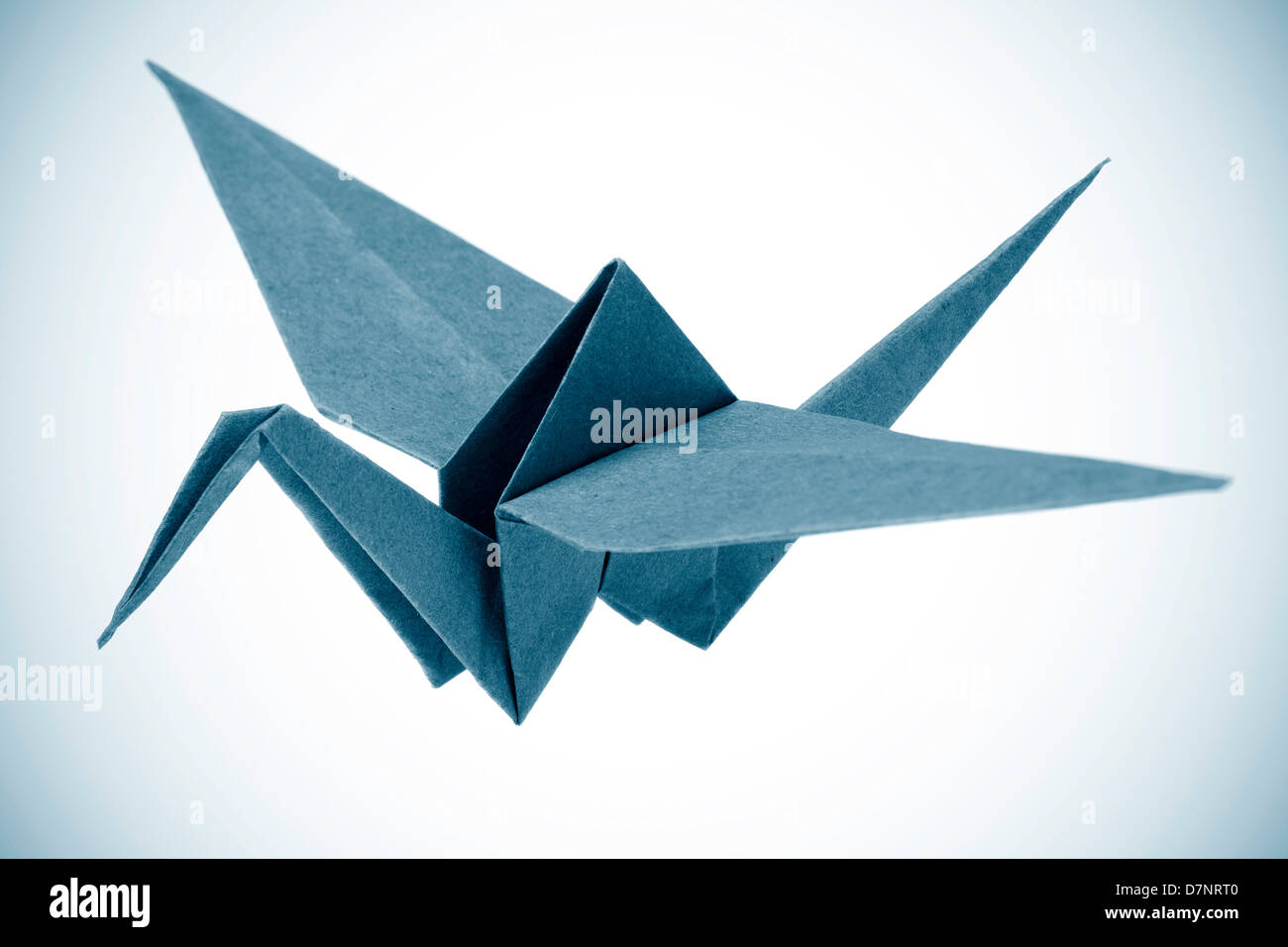 Origami crane isolated on a white background Stock Photo