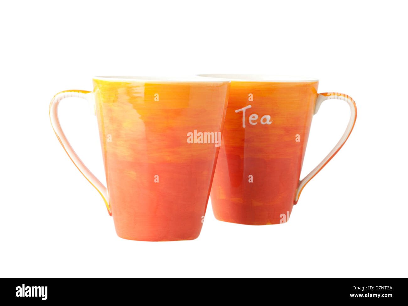Two colorful porcelain mugs on white background Stock Photo