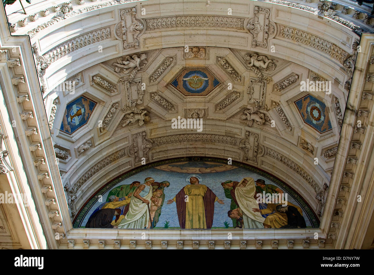 The magnificent arch above the entrance to the Berliner Dom, in Berlin, includes a mosaic depicting Jesus Christ healing the sic Stock Photo