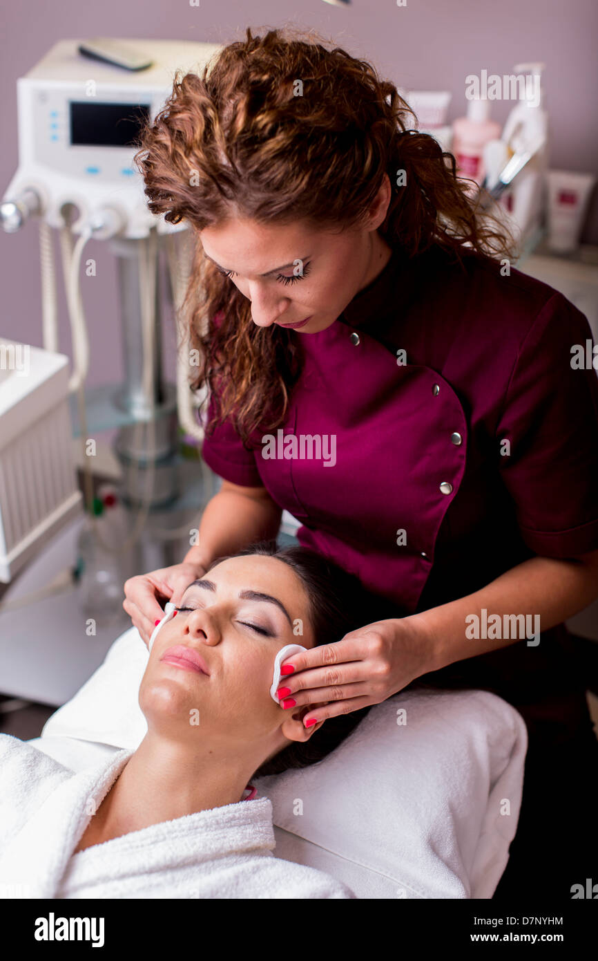 Young woman having a face massage Stock Photo
