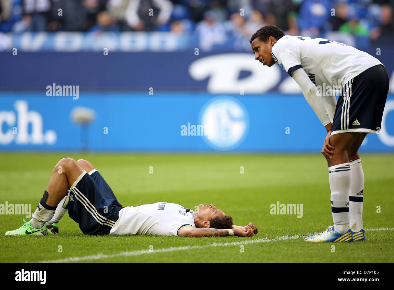 Schalke's Jermaine Jones (L) and Joel Matip  gesture on the pitch after the match FC Schalke 04 and VfB Stuttgart in Veltins-Arena in Gelsenkirchen, Germany, 11 May 2013. PHOTO: KEVIN KUREK   (ATTENTION: EMBARGO CONDITIONS! The DFL permits the further utilisation of up to 15 pictures only (no sequntial pictures or video-similar series of pictures allowed) via the internet and online media during the match (including halftime), taken from inside the stadium and/or prior to the start of the match. The DFL permits the unrestricted transmission of digitised recordings during the match exclusively  Stock Photo