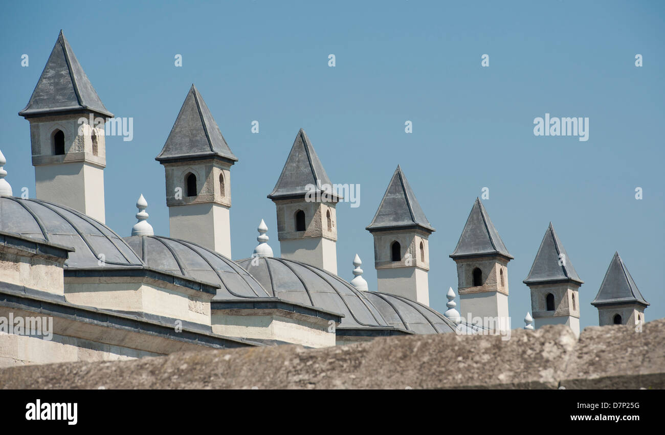 Row of spires on roof of old mosque in Istanbul Turkey showing ancient architecture Stock Photo