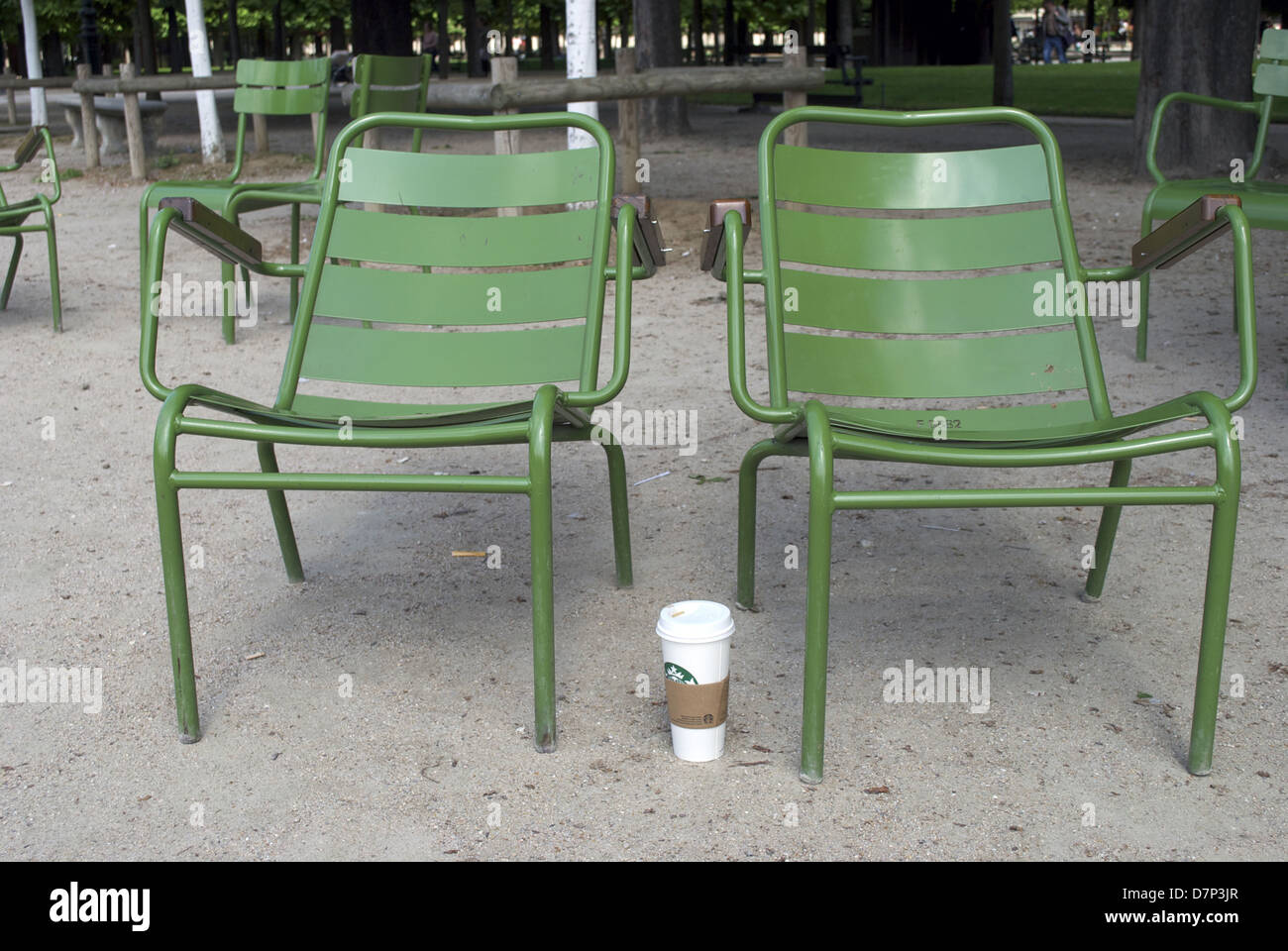 two park chairs and a coffee cup Stock Photo