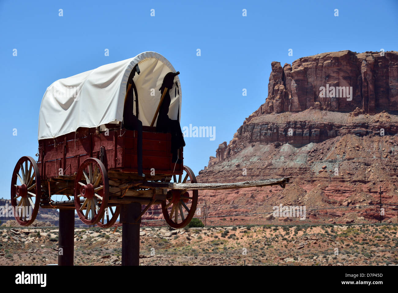 A wooden wagon with cutouts of old west pioneers. Moab, Utah, USA. Stock Photo