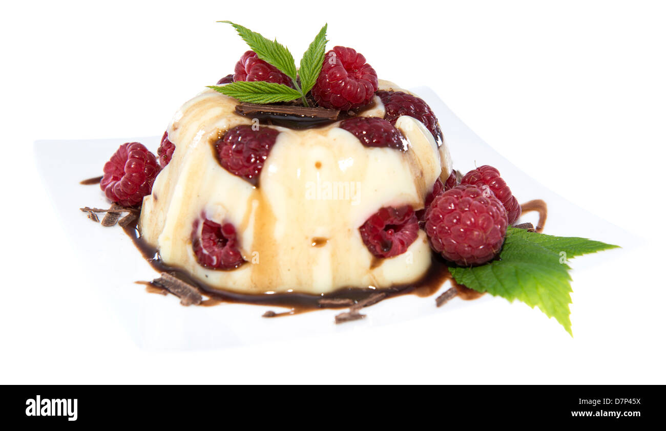 Raspberry vanilla Pudding with fresh berries isolated on white