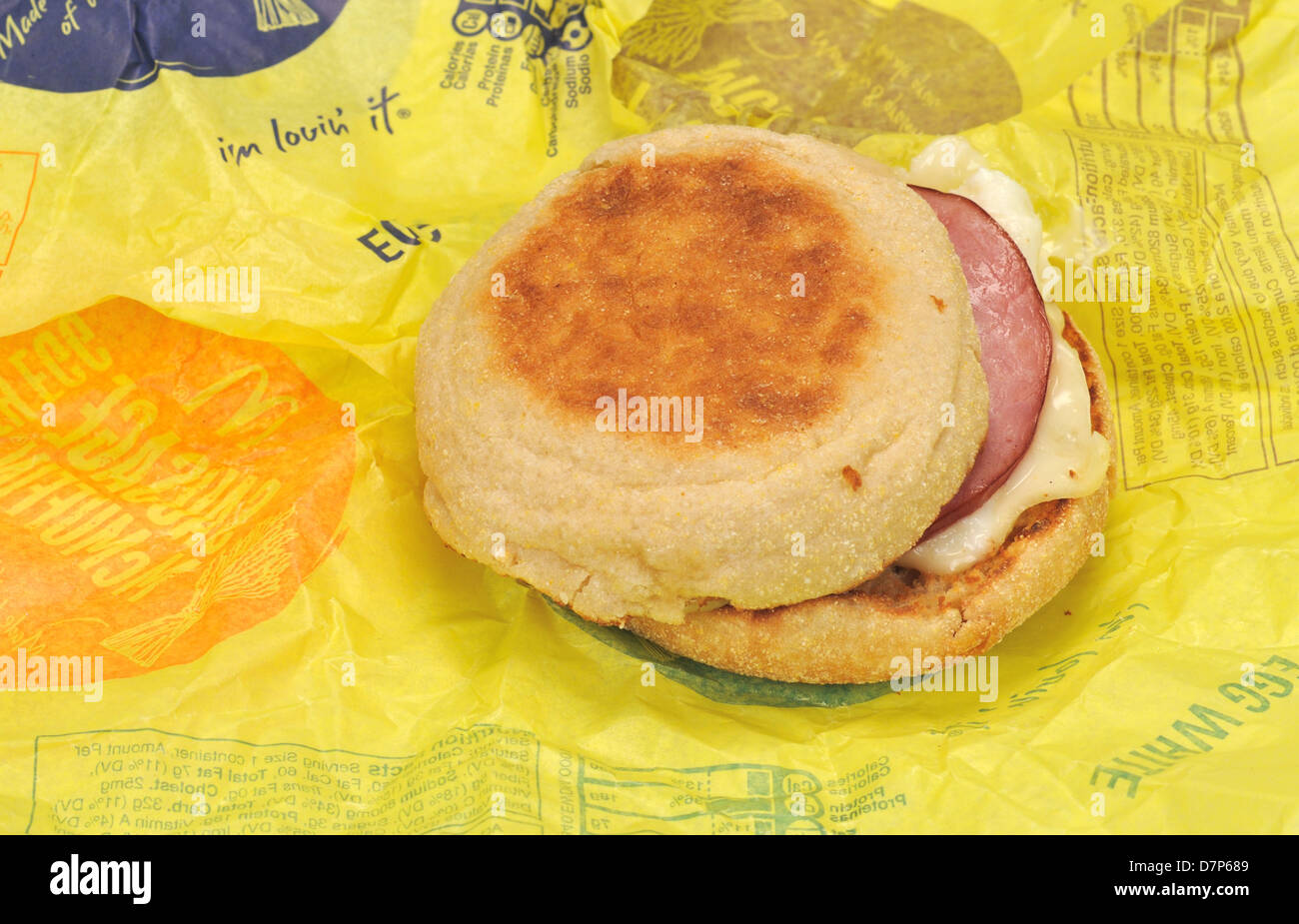 McDonald's Egg White Delight McMuffin breakfast sandwich with canadian bacon on paper wrapper. USA Stock Photo