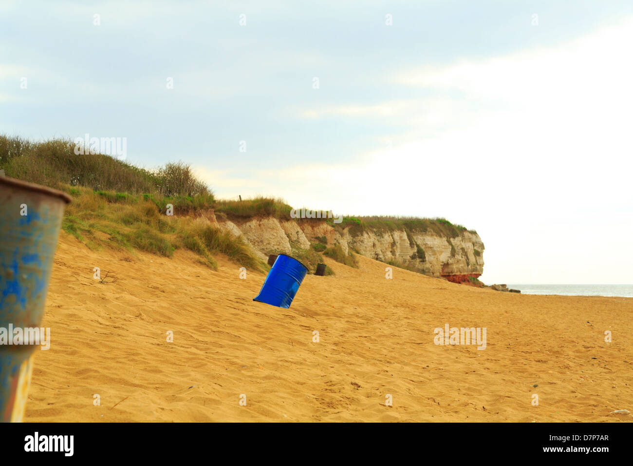 Abandoned metal drums on Hunstanton beach, Norfolk, England Stock Photo
