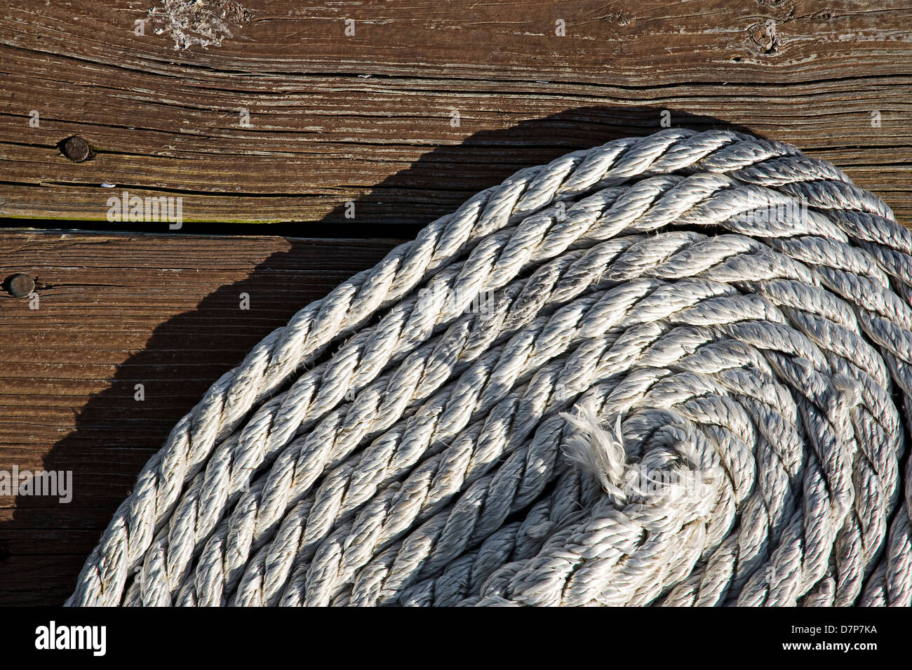 Rope Coil On Boat Dock Detail Stock Photo