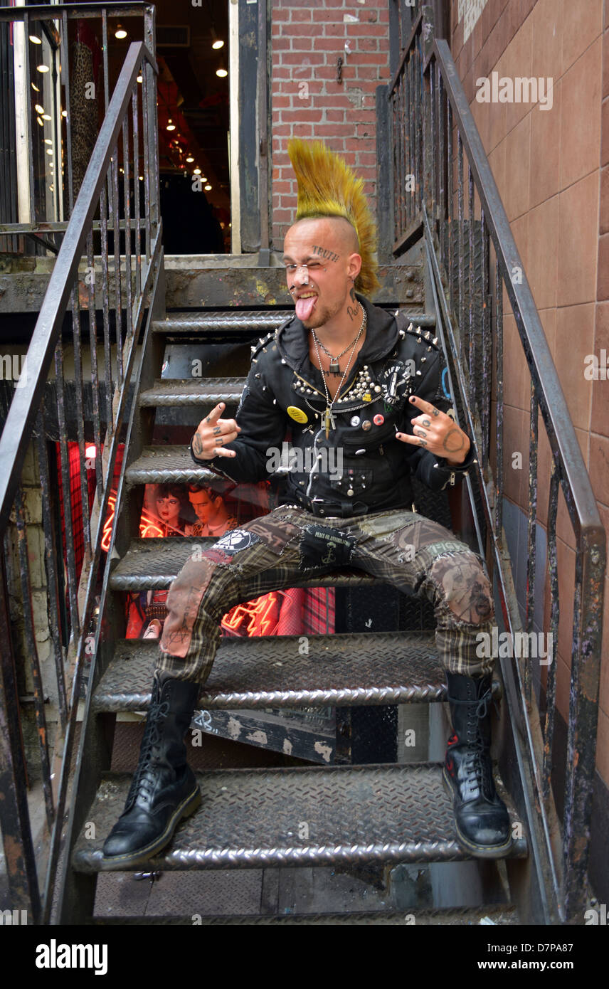 Portrait of a young man with a Mohawk hairdo, tattoos and piercings in Greenwich Village, New York Stock Photo