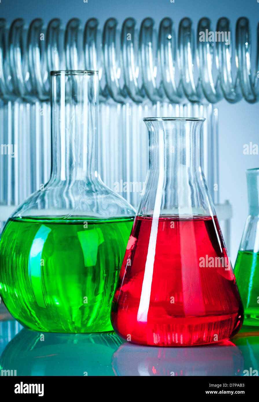 Glass test tubes in the laboratory on a blue background Stock Photo - Alamy