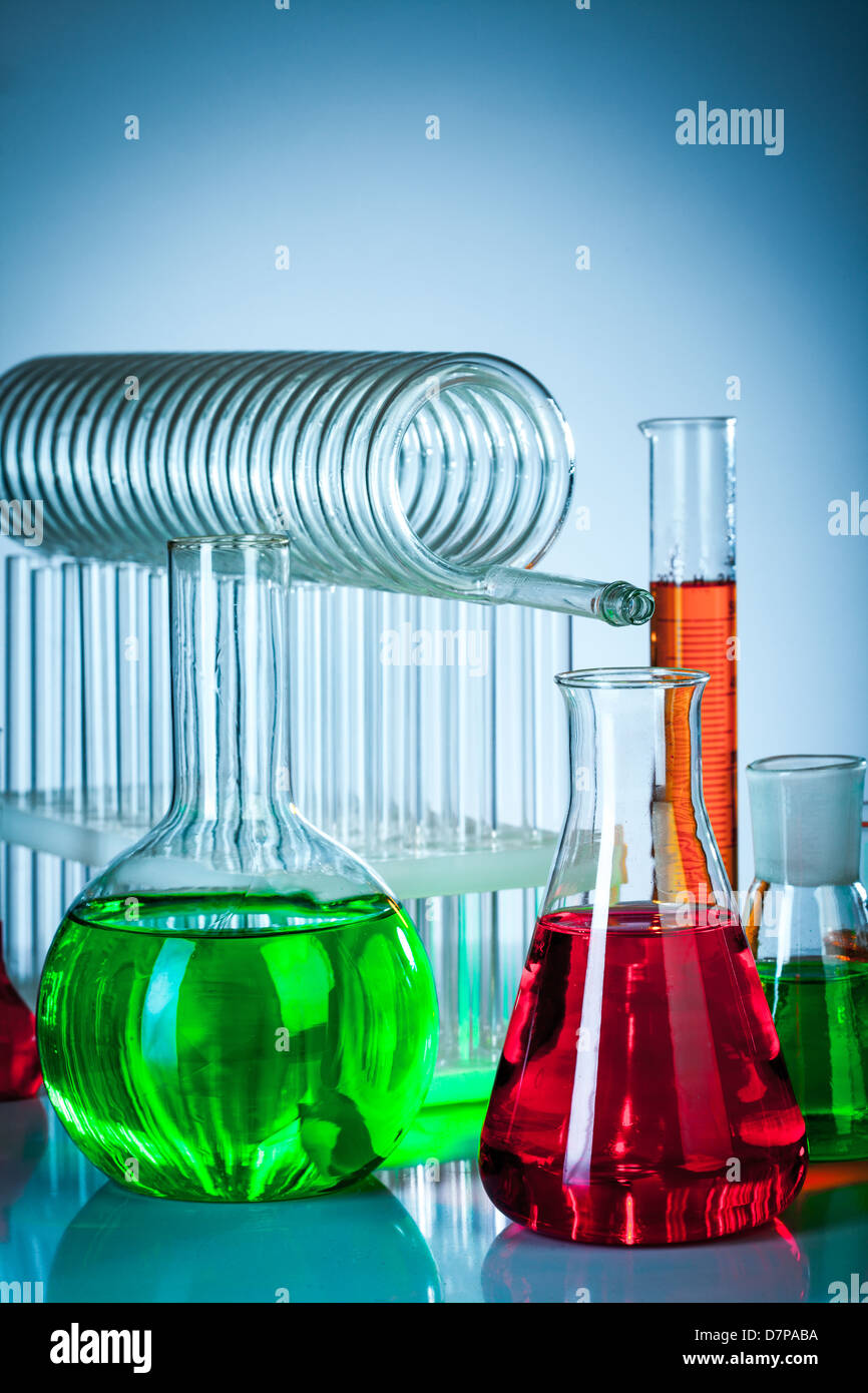 Glass test tubes in the laboratory on a blue background Stock Photo - Alamy