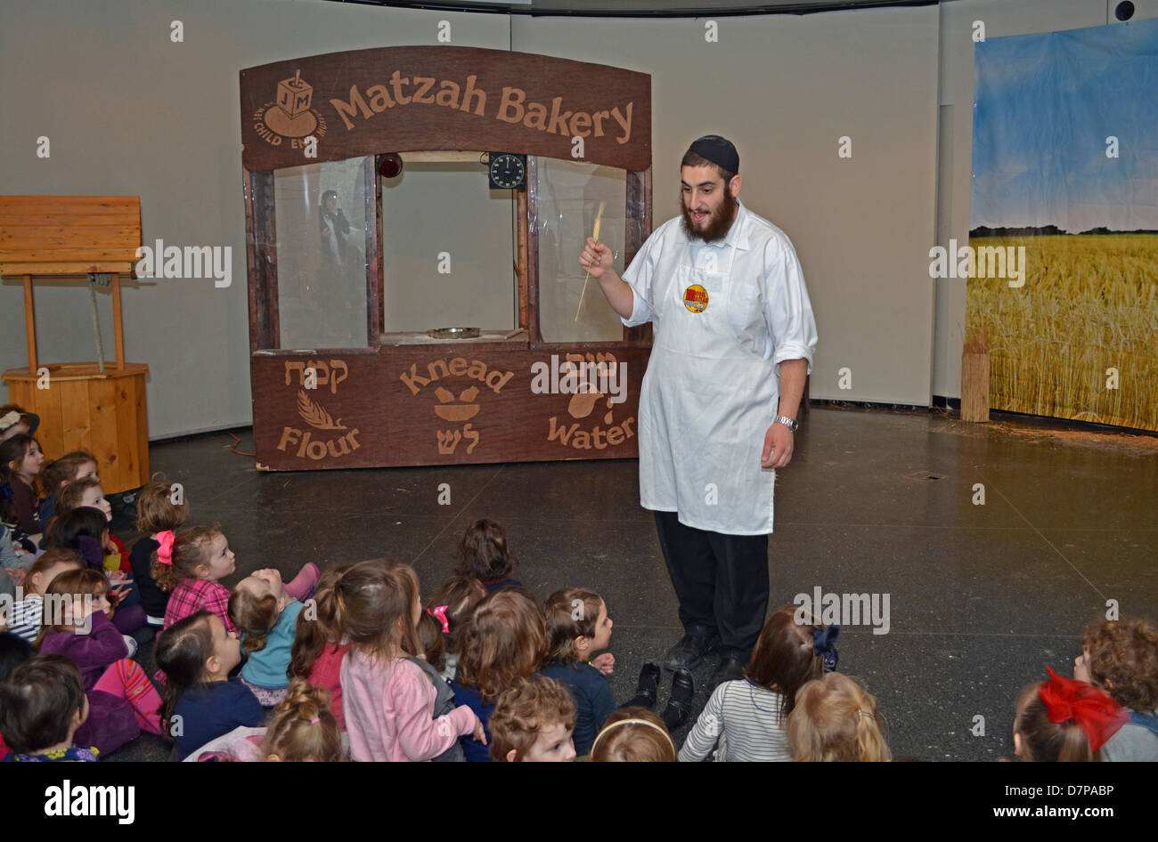 Religious Jewish girls learning about Matzoh at the Jewish Children's Museum in Brooklyn, New York Stock Photo