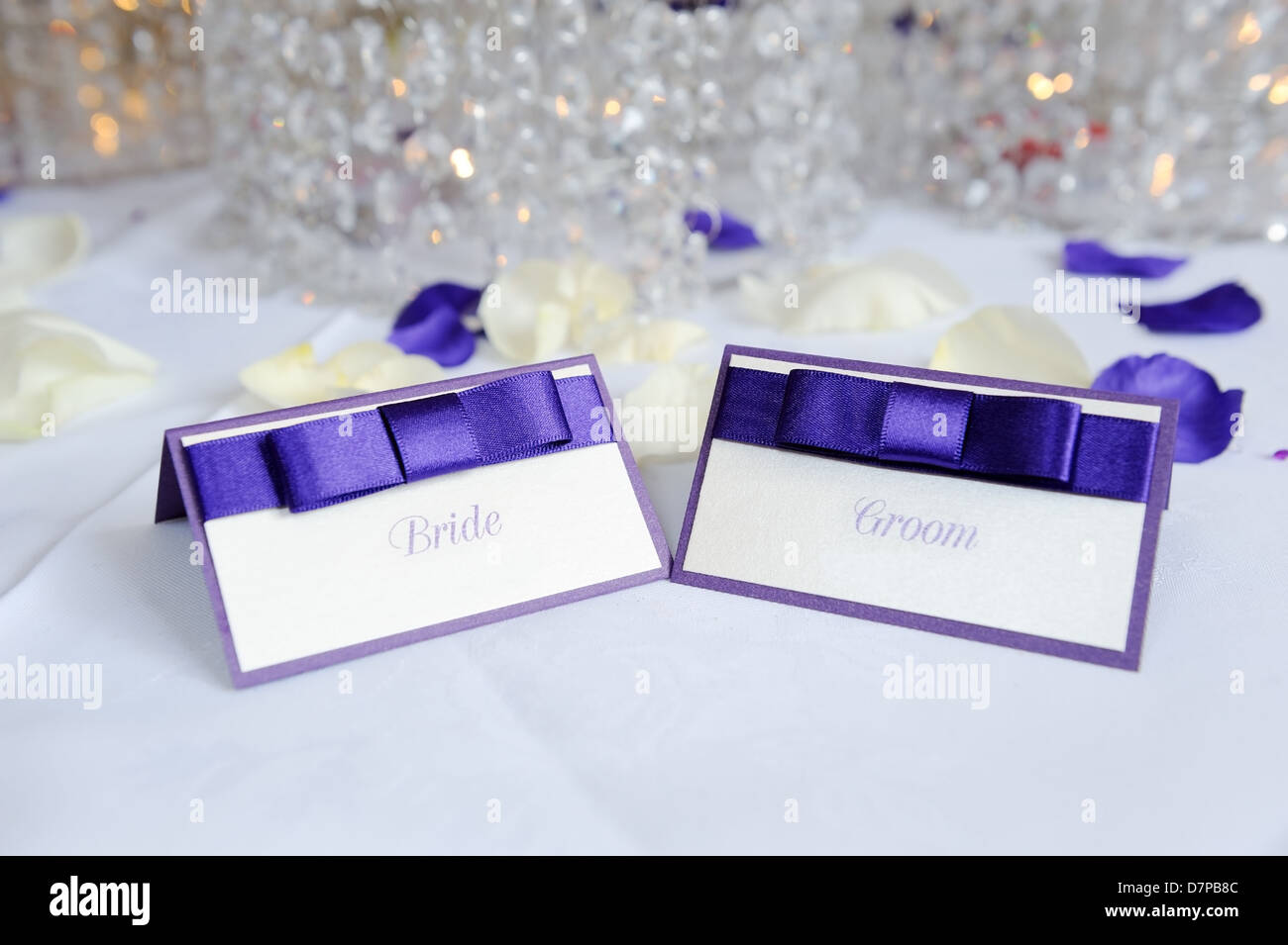 White and purple bride and groom place cards at wedding reception Stock ...