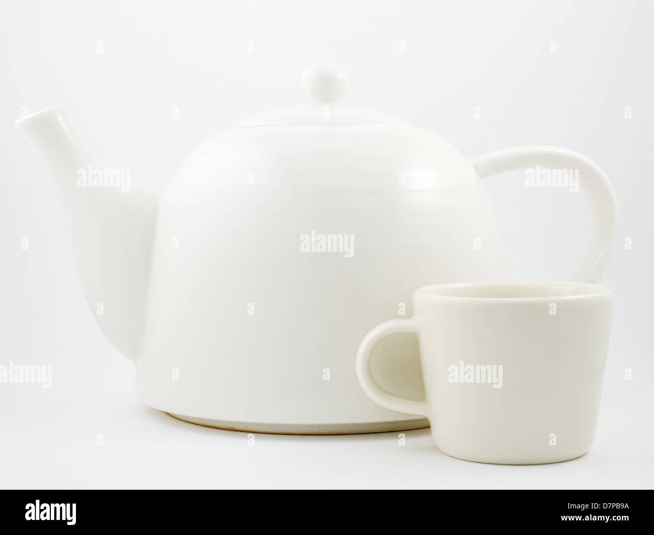 stylish white porcelain teapot and cup on a light background Stock Photo Alamy