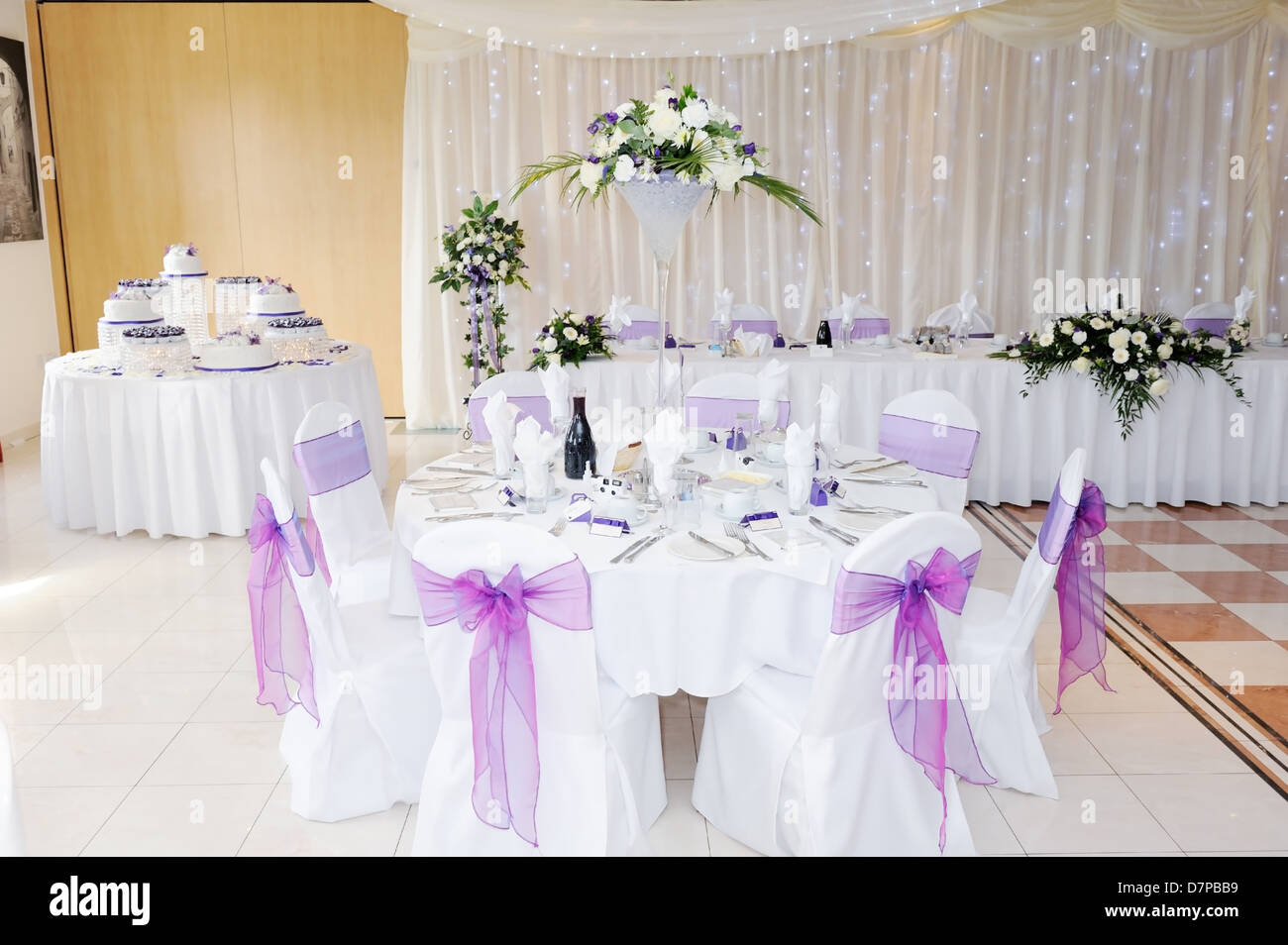 Wedding Reception Interior Showing Flowers And Cake Decoration