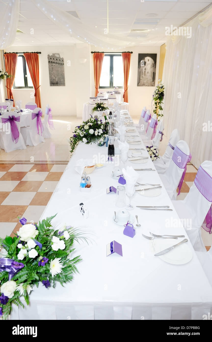 Table With White And Purple Flowers Decorate Wedding Reception
