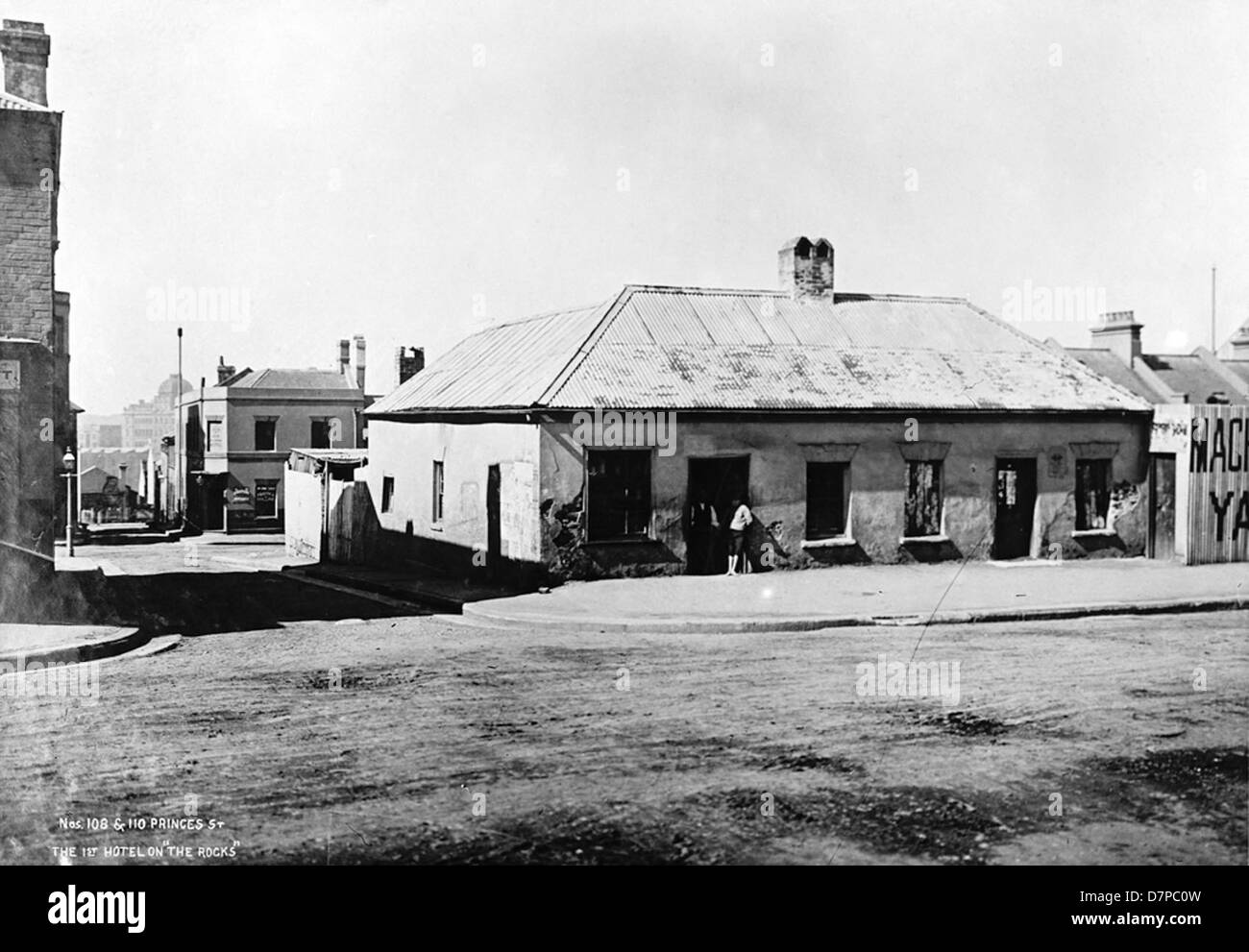 This historical image captures the first hotel on Princes Street, located in The Rocks, Australia. It represents a significant part of the area's early history, showcasing the architecture and the role of hospitality establishments in shaping The Rocks' cultural landscape. Stock Photo