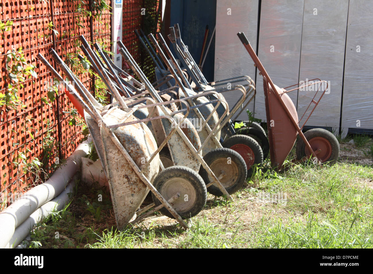 lots of wheelbarrows on building site Stock Photo - Alamy
