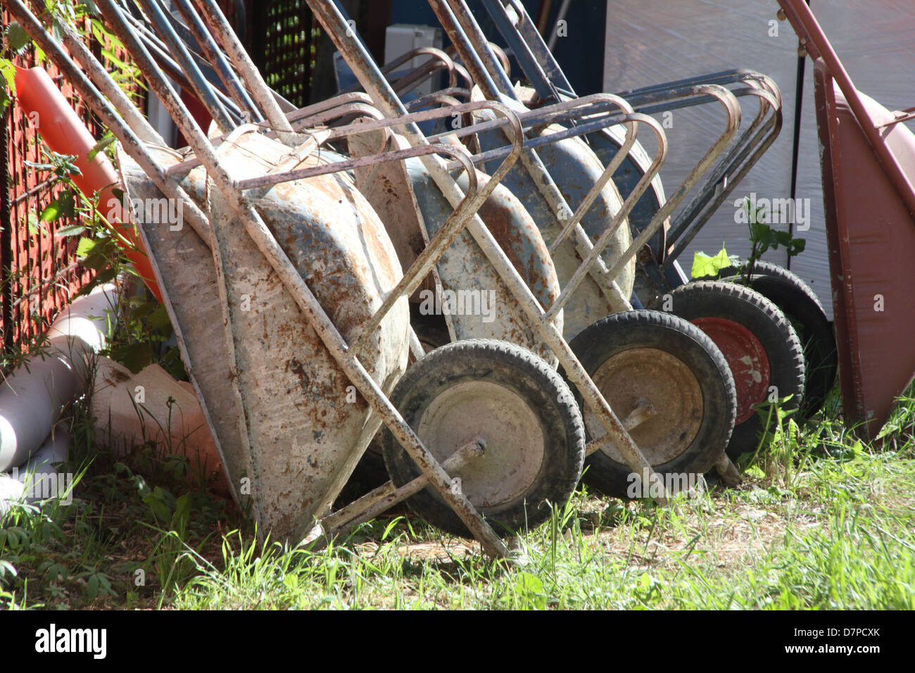 lots of wheelbarrows on building site Stock Photo - Alamy