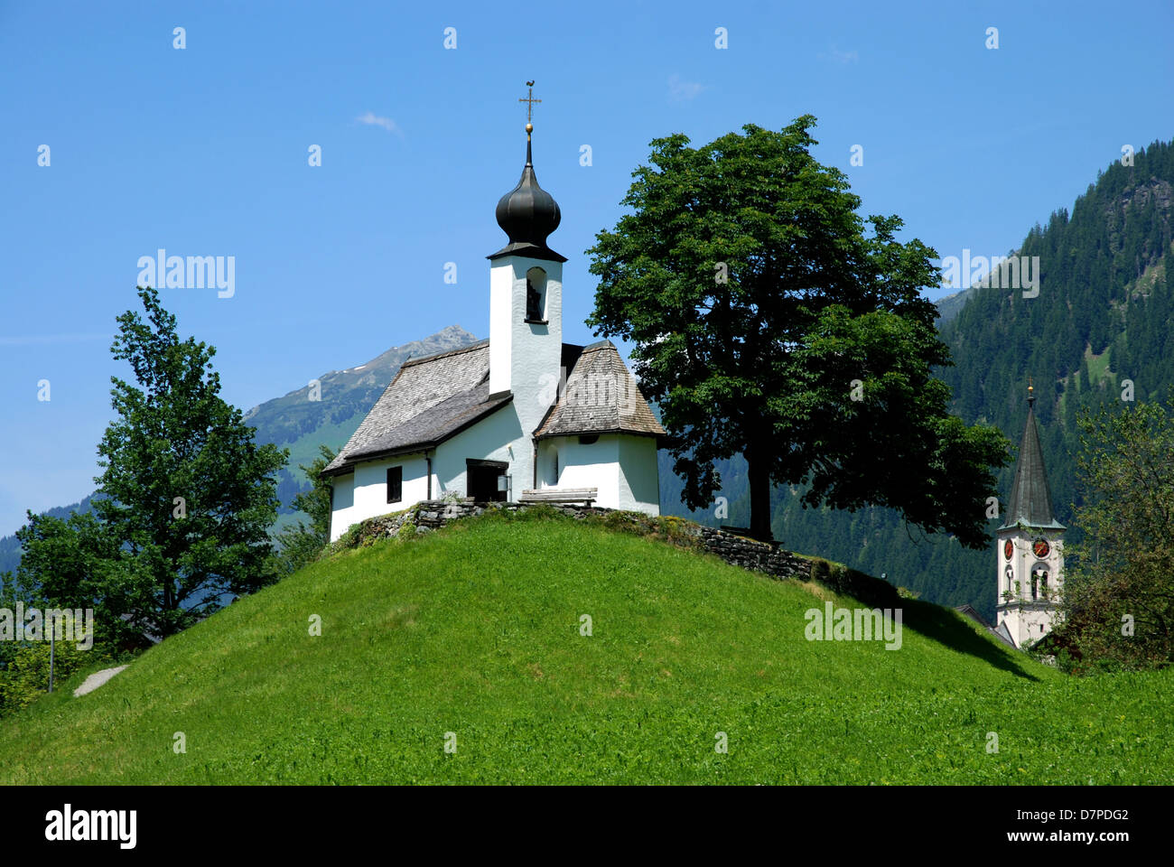 Mountain chapel on a hill in Gaschurn in the Montafon, Bergkapelle auf einem Huegel in Gaschurn im Montafon Stock Photo