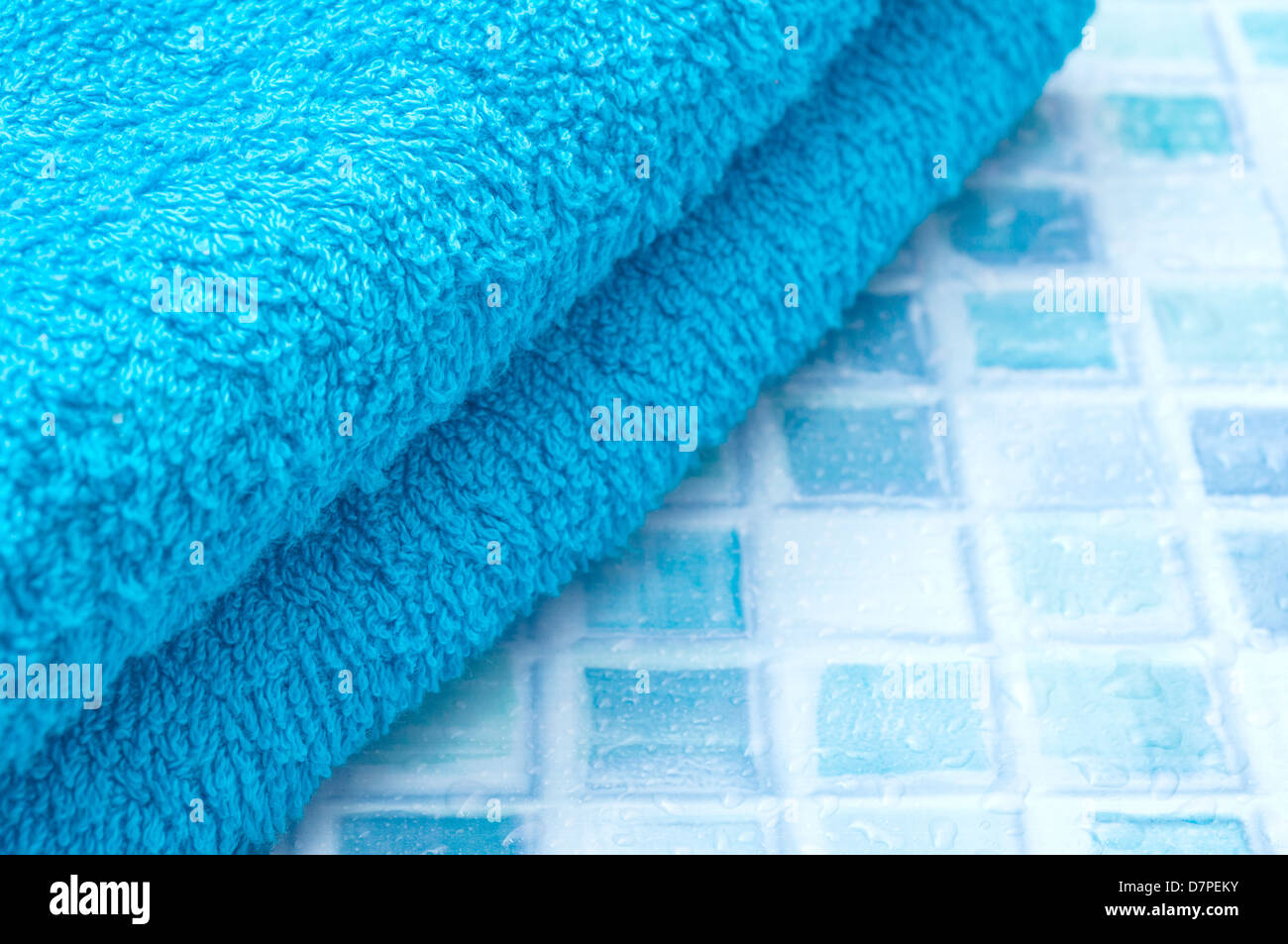 Blue Bath Towels on Blue Bathroom Tiles Stock Photo Alamy