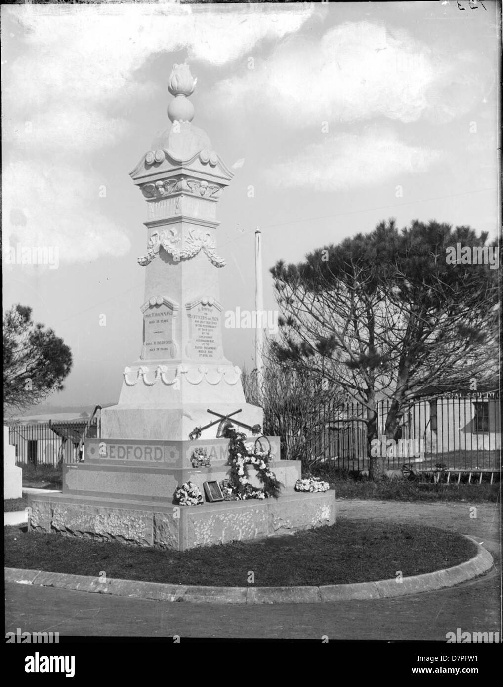 War memorial with stepped plinths and ornate column Stock Photo