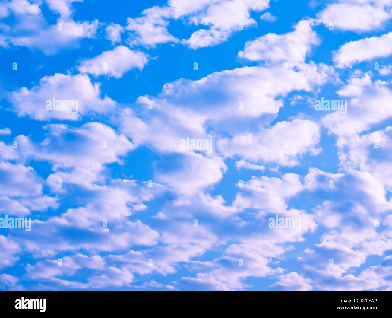 Blue sky with fluffy clouds background Stock Photo - Alamy