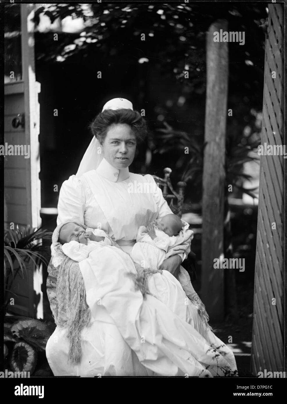 Vintage nurse holding baby hi-res stock photography and images - Alamy