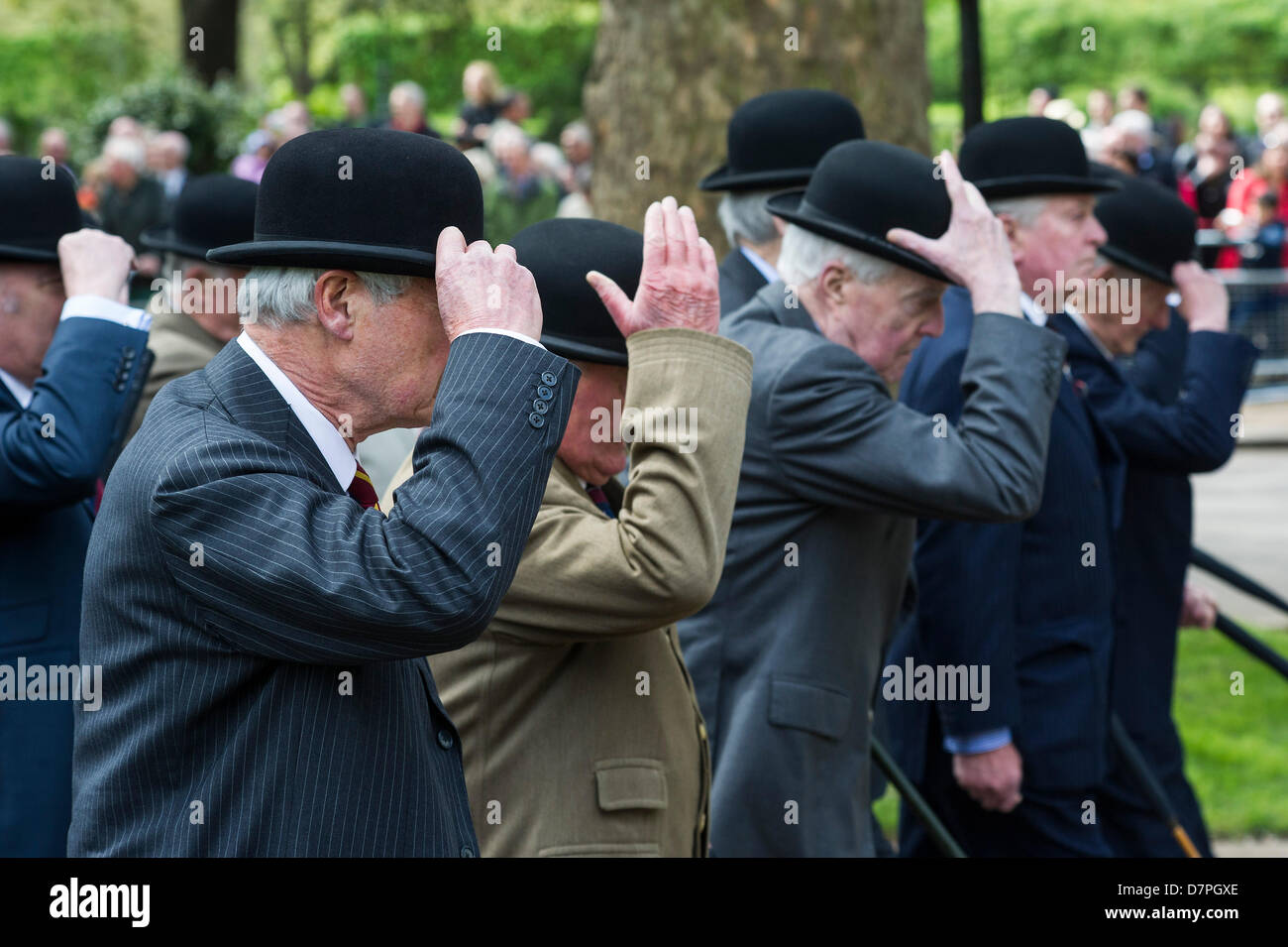 Hyde Park, London, UK 12 may 2013. Her Royal Highness The Princess Royal KG, KT, GCVO, Colonel in Chief The King’s Royal Hussars takes the salute and lays a wreath at the Annual Parade and Service of The Combined Cavalry Old Comrades Association at the Cavalry Memorial. Officers wear bowler hats and suits are worn instead of uniform by all but the bands.  5 bands led marching detachments of the Cavalry and Yeomanry Regimental Associations and Veterans ranging from World War 2 to Iraq and Afghanistan. State Trumpeters of the Household Cavalry and a Piper from F Company The Scots Guards also too Stock Photo