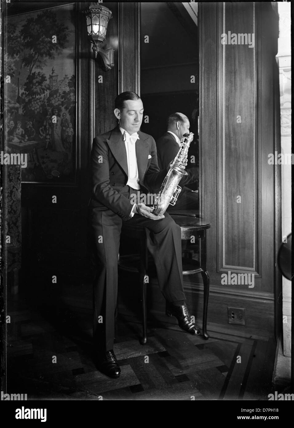 Sam Babicci holding saxophone Stock Photo