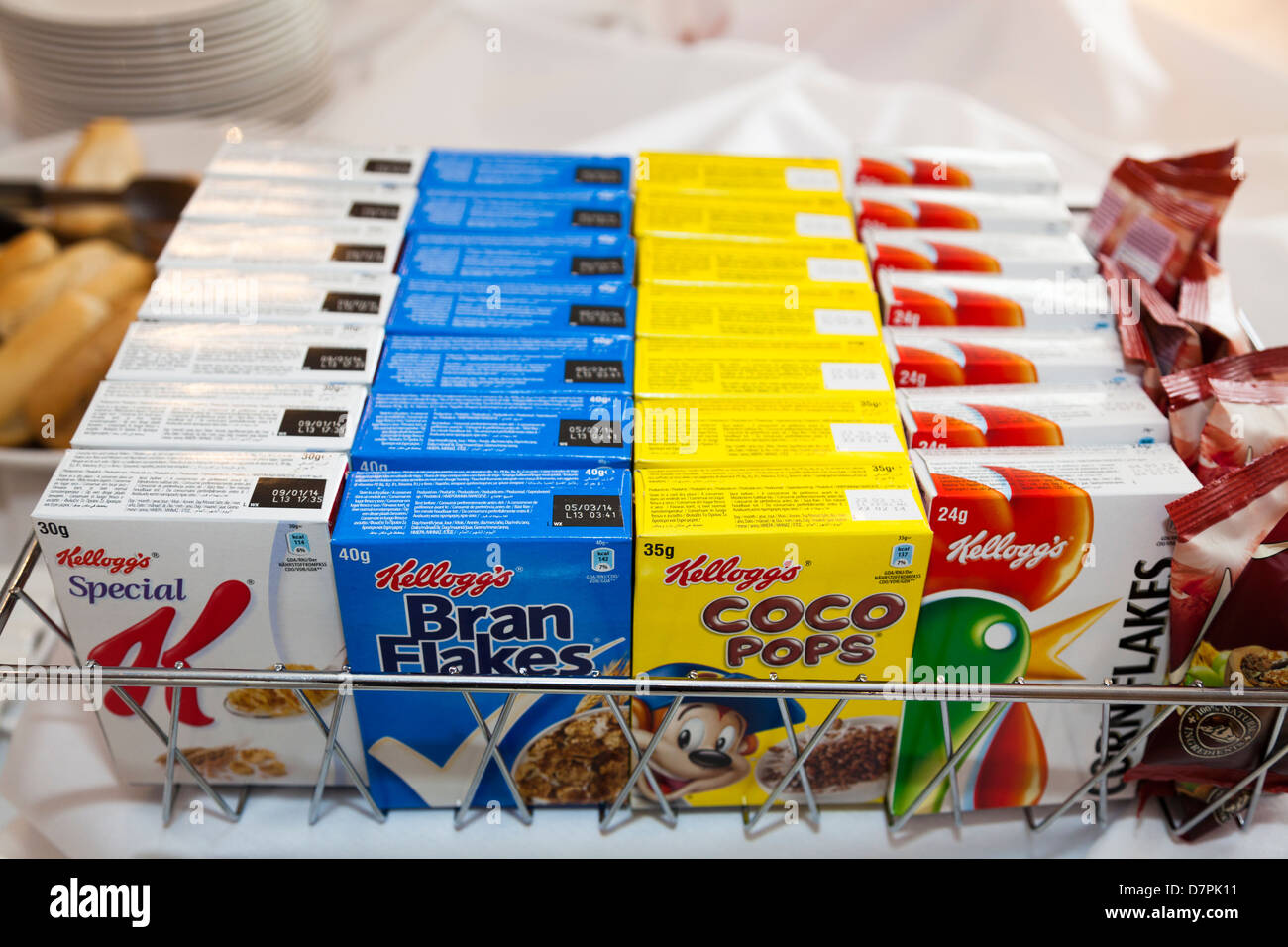 Individual packets of Kellogg’s breakfast cereal on a hotel breakfast table Stock Photo