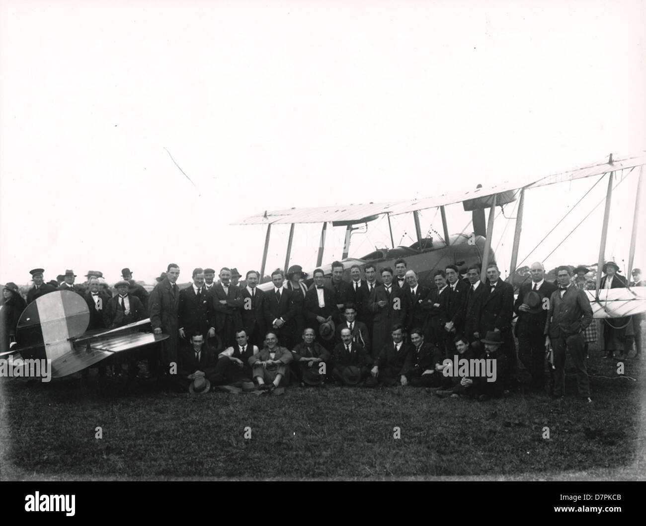 group posing in front of an Avro 504 K aeroplane, 1920 Stock Photo