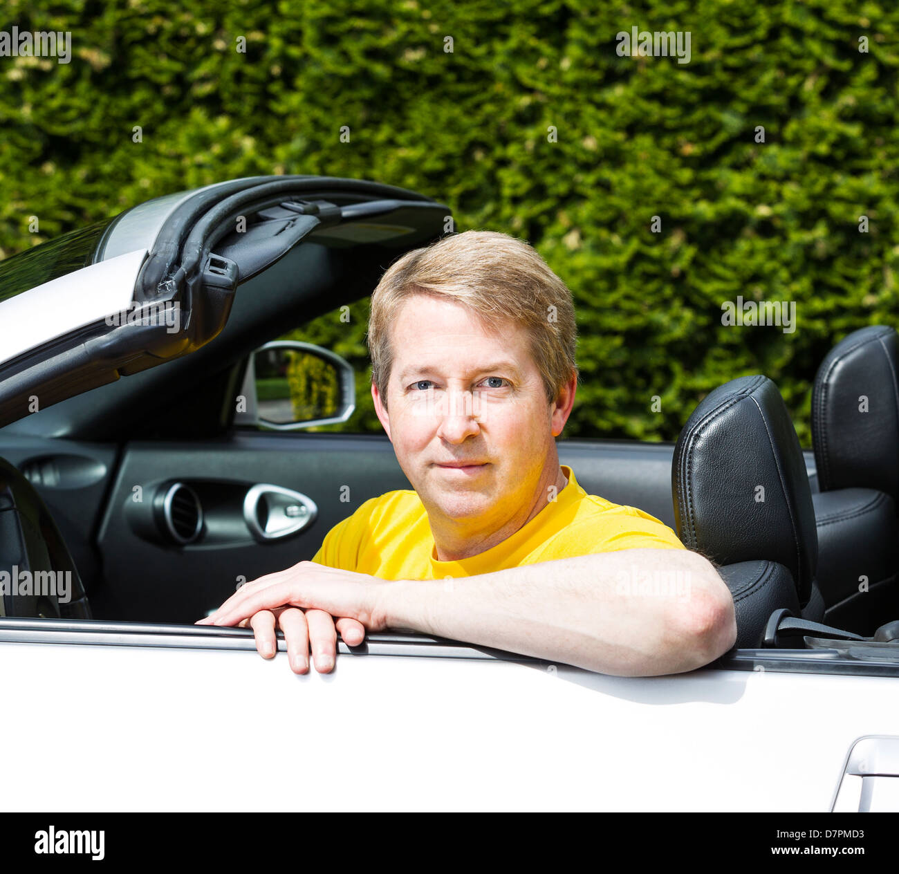 Mature man in convertible car during nice weather Stock Photo Alamy