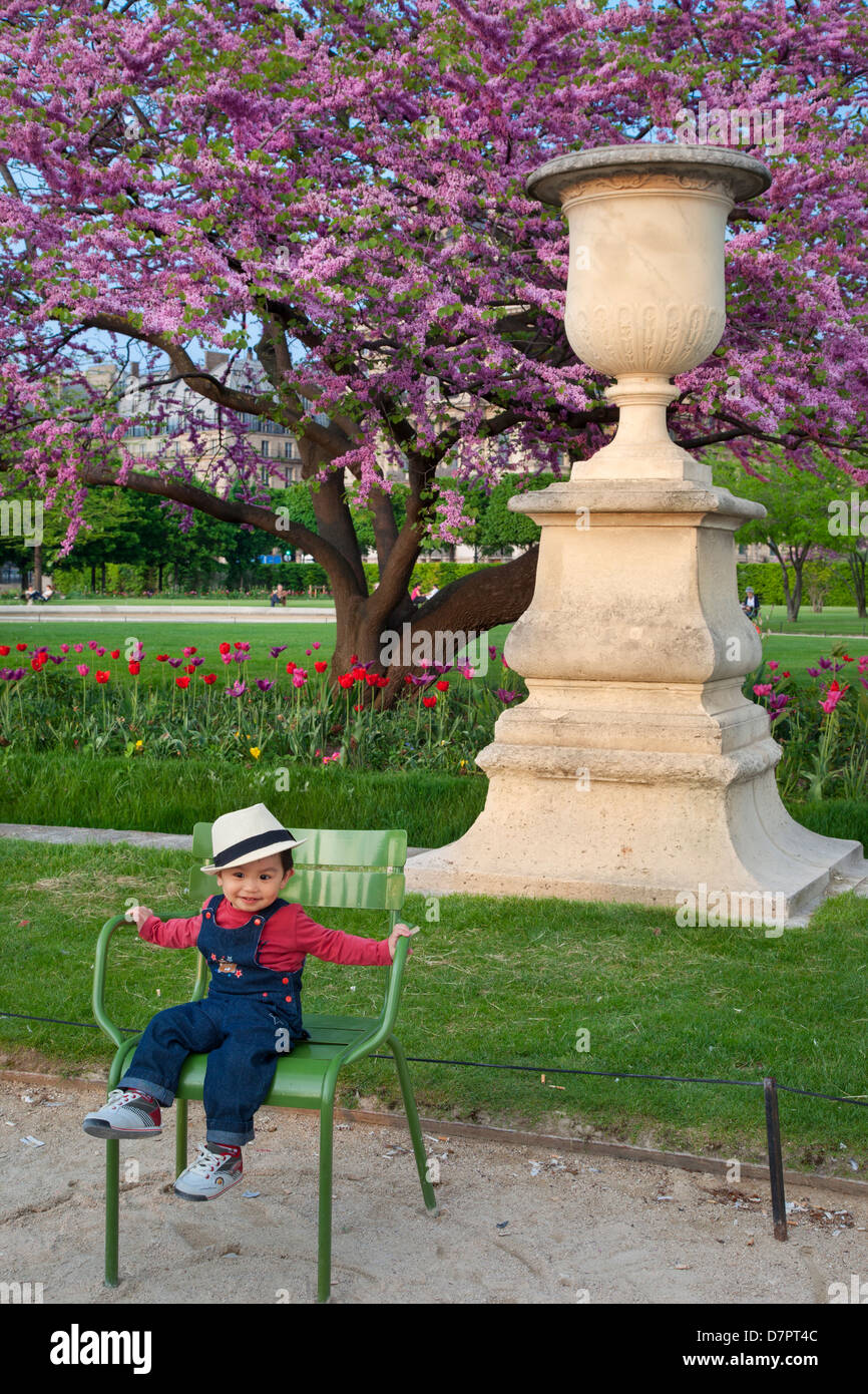 Young Asian boy in Jardin des Tuileries, Paris, France Stock Photo