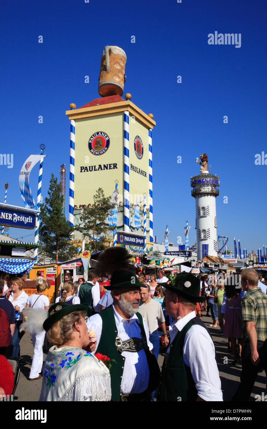 Oktoberfest, traditional bavarians infront of Paulaner Zelt at Theresienwiese fairground, Munich, Bavaria, Germany Stock Photo