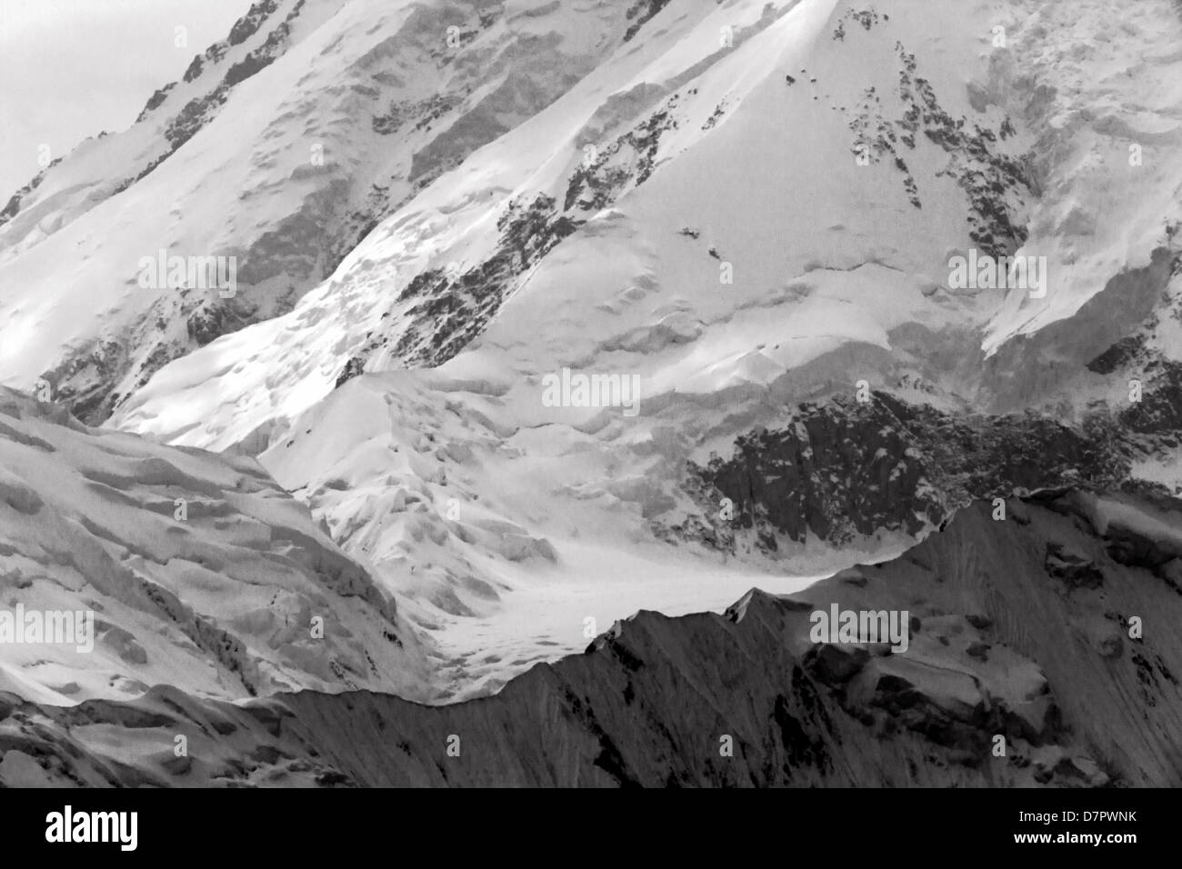 Black and white view of Mt. McKinley (Denali Mountain), highest point N America 20,320' peaking above clouds, Denali Nat'l Park Stock Photo