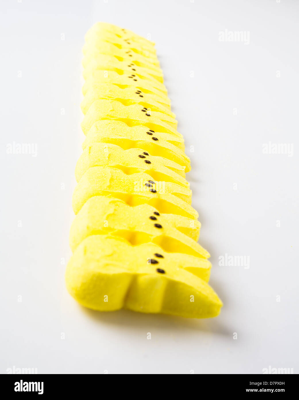 Yellow Easter candy on a white Background. Stock Photo