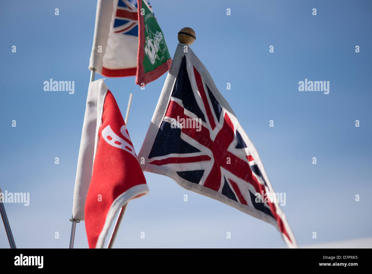 union jack blowing in the wind, 3 flags Stock Photo