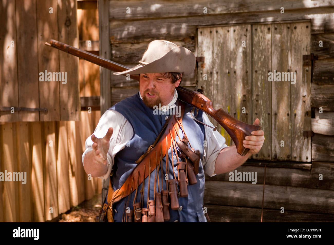 A reenactor demonstrate how to fire a musket in the Colonial Quarter, St. Augustine, Stock Photo