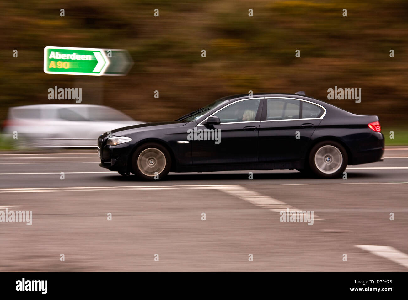 Rear sync flash technique used to capture a BMW car travelling along