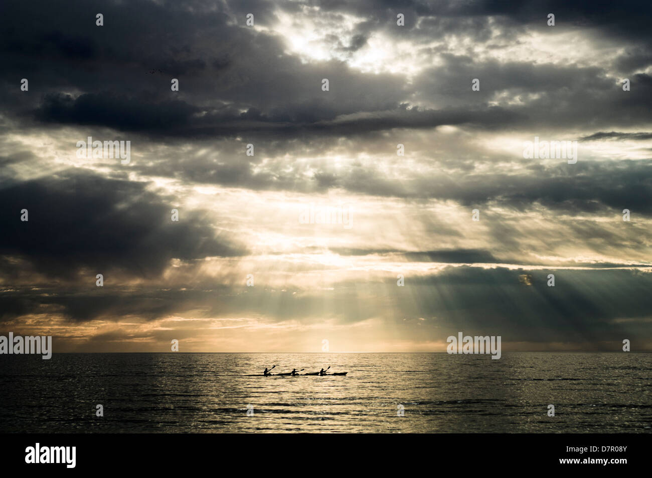 Three sea kayakers Stock Photo
