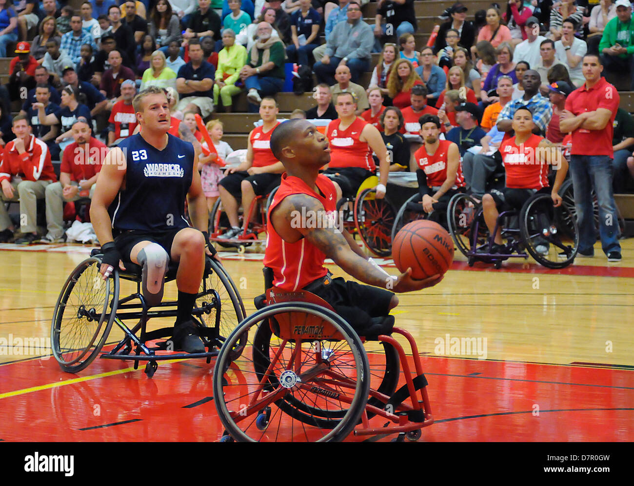 May 12, 2013: Opening round wheelchair basketball action between the Marine Corps and Navy/Coast Guard during the first day of Warrior Games competition at the United States Olympic Training Center, Colorado Springs, Colorado. Over 260 injured and disabled service men and women have gathered in Colorado Springs to compete in seven sports, May 11-16. All branches of the military are represented, including Special Operations and members of the British Armed Forces. Stock Photo
