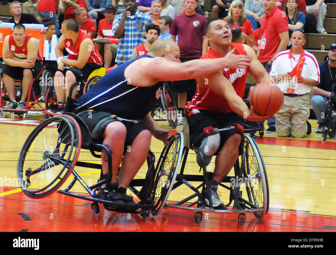 May 12, 2013: Opening round wheelchair basketball action between the Marine Corps and Navy/Coast Guard during the first day of Warrior Games competition at the United States Olympic Training Center, Colorado Springs, Colorado. Over 260 injured and disabled service men and women have gathered in Colorado Springs to compete in seven sports, May 11-16. All branches of the military are represented, including Special Operations and members of the British Armed Forces. Stock Photo