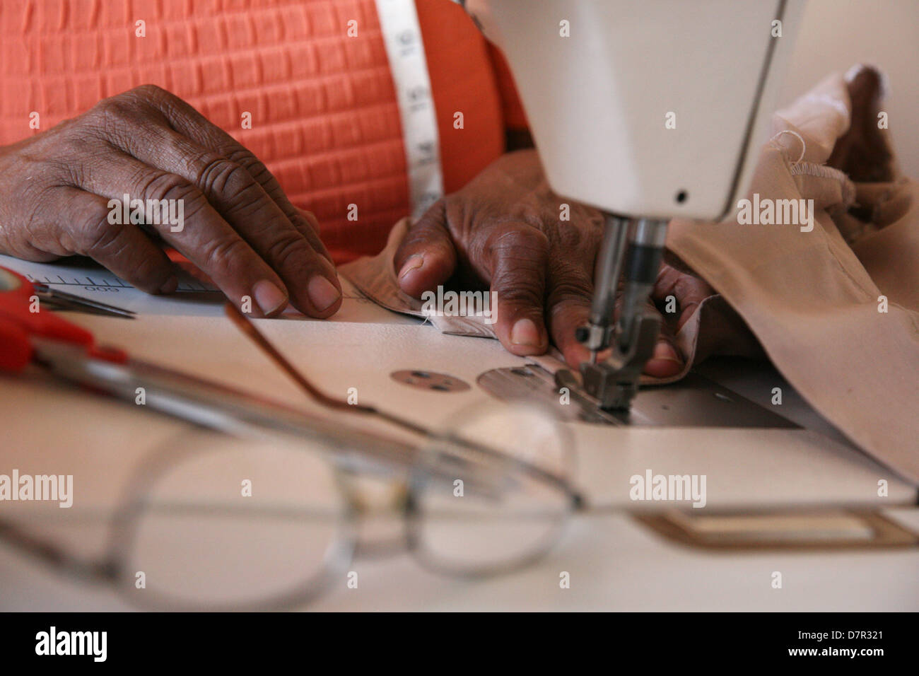 African hands sewing on a machine Stock Photo Alamy