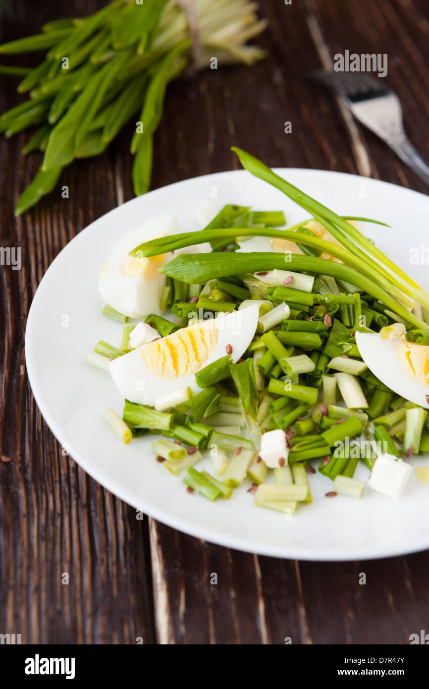 salad with wild garlic and boiled egg, food closeup Stock Photo
