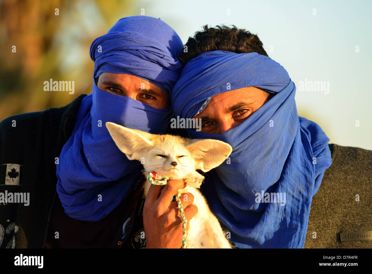 Young Bedouins in the dunes at Douz, South of Tunisia. Stock Photo