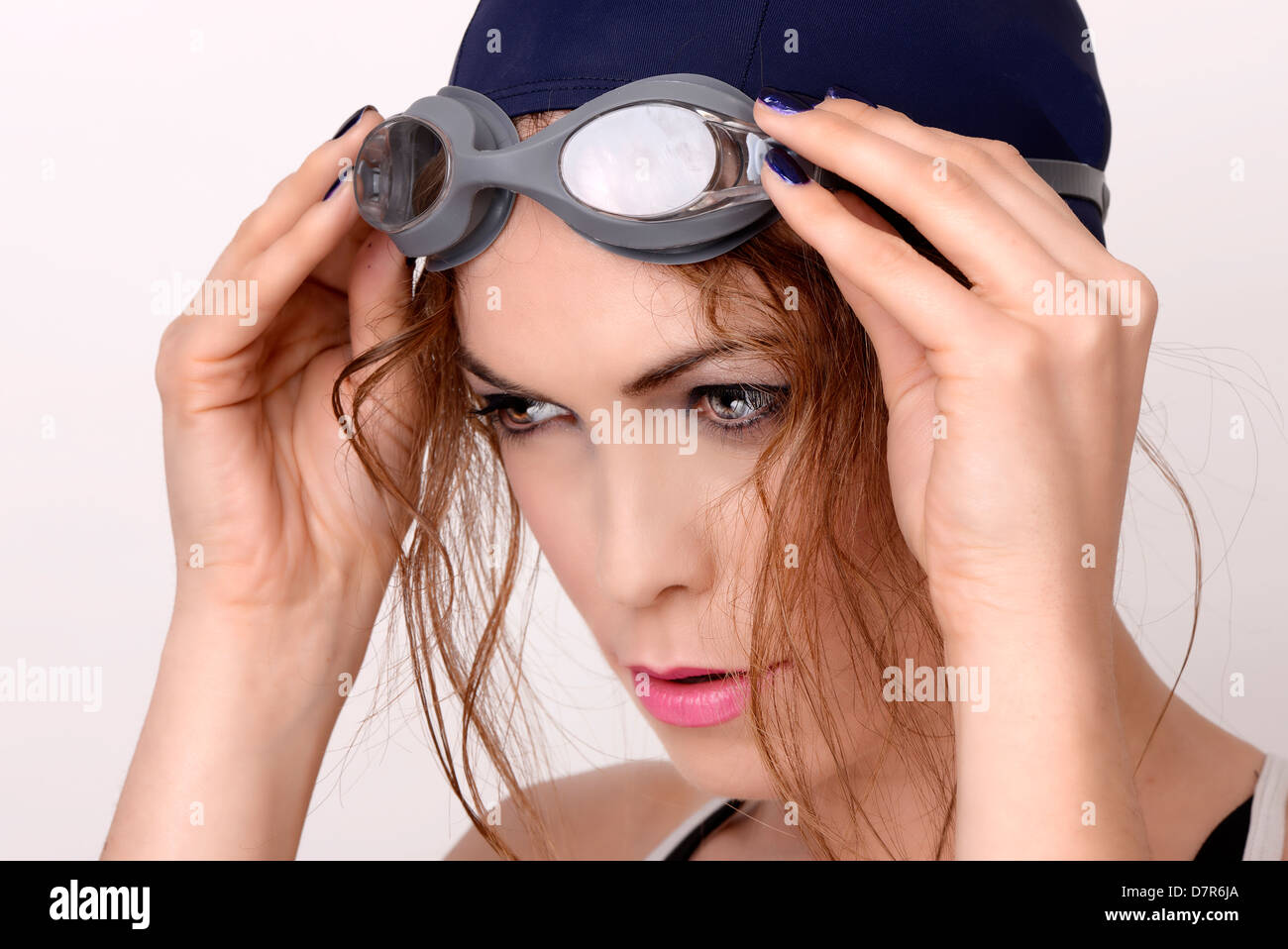 Female swimmer wearing swim cap hires stock photography and images Alamy
